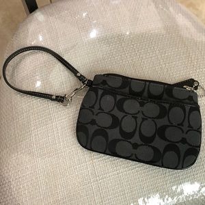 Coach wristlet with hanging tag